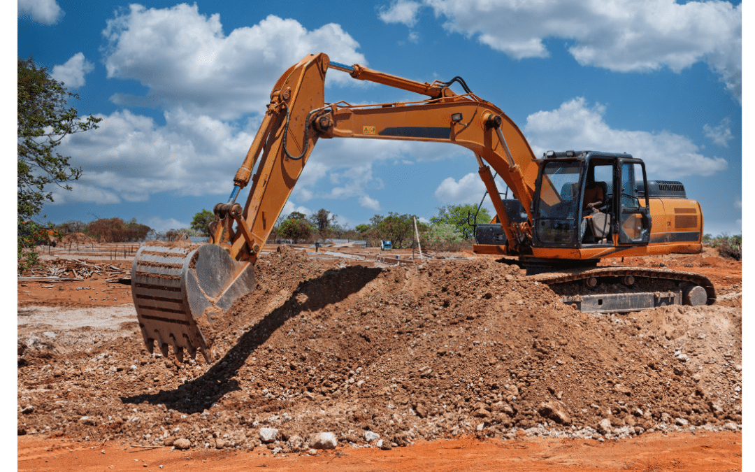 Excavatrice en action préparant un terrain constructible avant la construction d’une maison au Québec